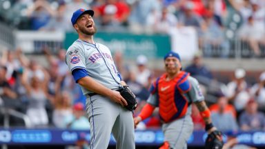  Tylor Megill #38 of the New York Mets reacts after fielding the ball for an out in the fifth inning during the game between the New York Mets and the Atlanta Braves at Truist Park on Monday, September 30, 2024 in Atlanta, Georgia. (Photo by Todd Kirkland/MLB Photos via Getty Images)