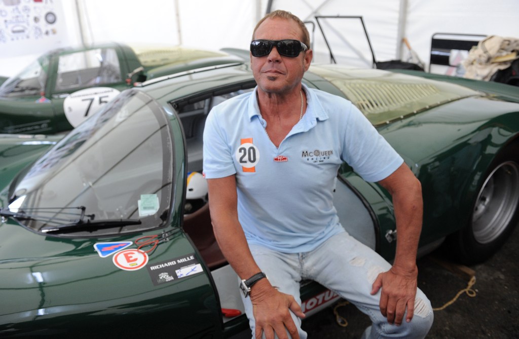 Chad McQueen sitting on a 1966 Porsche 906 