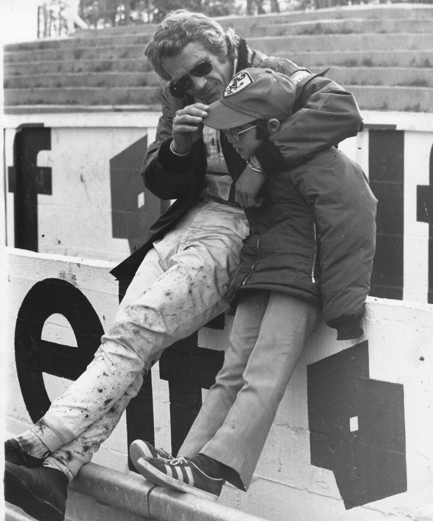 Steve McQueen relaxes with his son Chad as he stars in the movie 'Le Mans' 