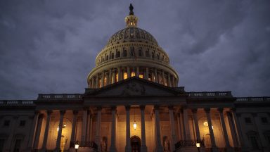   The U.S. Capitol is seen at dusk, January 21, 2018 in Washington, DC. Lawmakers are convening for a Sunday session to try to resolve the government shutdown. (Photo by Drew Angerer/Getty Images)