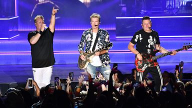  (L-R) Singers Gary LeBox, Joe Don Rooney, Jay DeMarcus of the band Rascal Flatts performs onstage at FivePoint Amphitheatre on August 01, 2019 in Irvine, California. (Photo by Scott Dudelson/Getty Images)