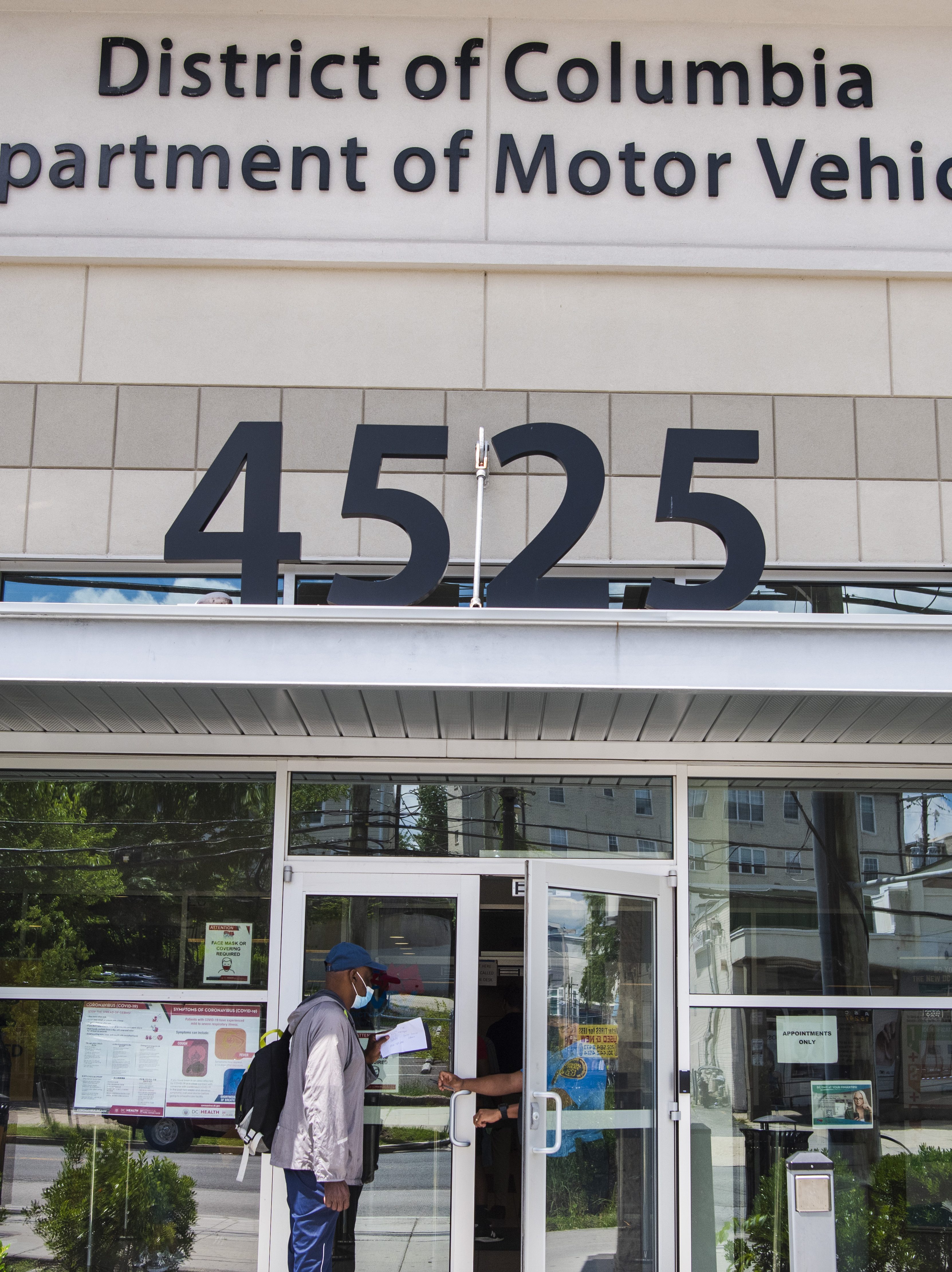 WASHINGTON, D.C. - JUNE 24: Garry Scott, 68, makes a stop at the Department of Motor Vehicles Benning Ridge Service Center to request information and turn in old license plates on Thursday, June 24, 2021 in Washington, D.C. Mr. Scott made an appointment at the the DMV location weeks prior to renew his license after Mayor Muriel Bowser announced a four-month amnesty program for drivers. However, when he arrived he was frustrated to find that the program was aimed to give an opportunity to pay outstanding tickets with the penalties waived but the original fines still remained.  "I came back to get information and badge info to file an incident report with special police regarding a previous incident during a scheduled appointment on the 15th," said Scott of an issue that resulted with security personnel during his appointment. (Photo by Amanda Voisard/for The Washington Post via Getty Images)