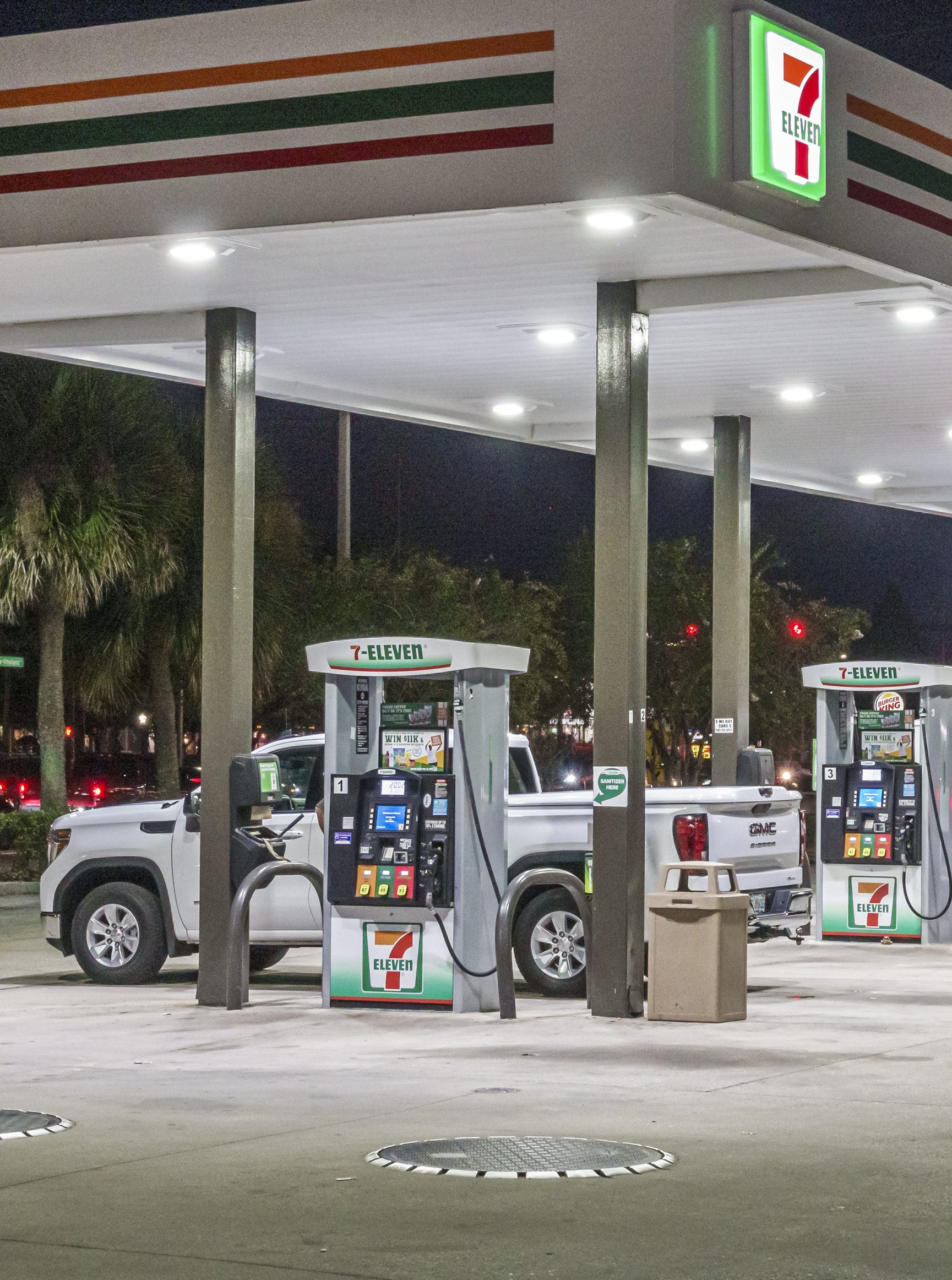 Orlando, Florida, South Apopka Vineland Road, 7 Eleven gas station at night.