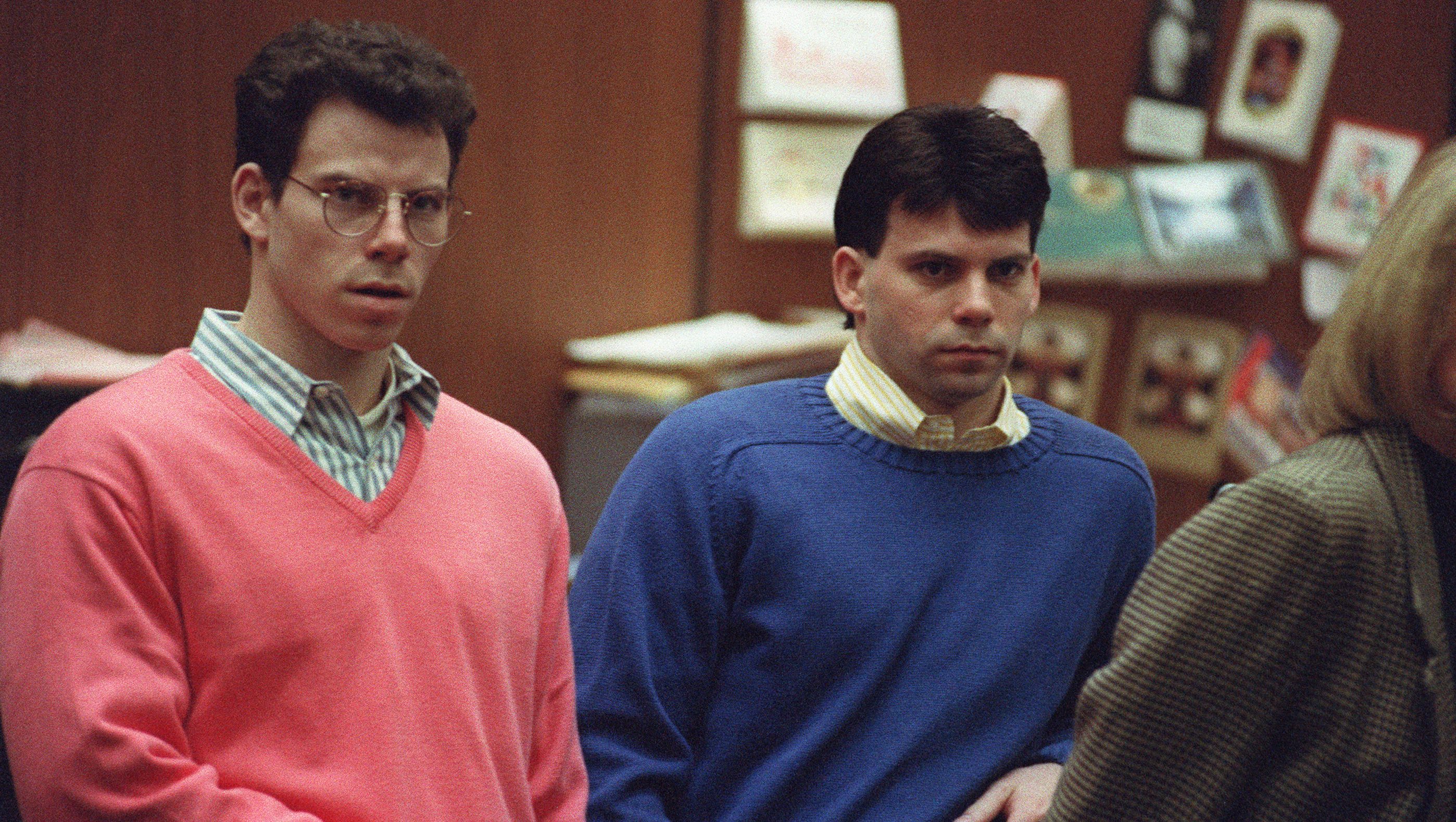 Erik Menendez (L) and his brother Lyle (R) listen during a pre-trial hearing, on December 29, 1992 in Los Angeles after the two pleaded innocent in the August 1989 shotgun deaths of their wealthy parents, Jose and Mary Louise Menendez of Beverly Hills, Calif. It took 40 months for the Superior Court arraignment after prosecutors and defense attorneys battled over the admissibility of taped confessions the brothers allegedly made to their psychotherapist. AFP PHOTO VINCE BUCCI (Photo by VINCE BUCCI / AFP) (Photo by VINCE BUCCI/AFP via Getty Images)