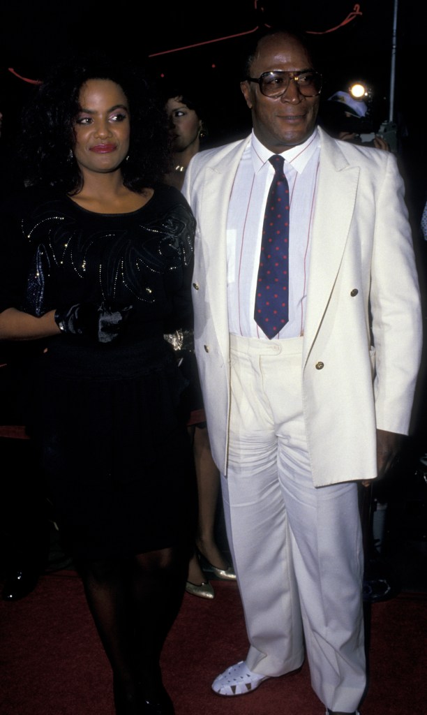   John Amos and daughter Shannon Amos attend the premiere of "Coming To America" on June 26, 1988 at Mann Chinese Theater in Hollywood, California. (Photo by Ron Galella, Ltd./Ron Galella Collection via Getty Images)