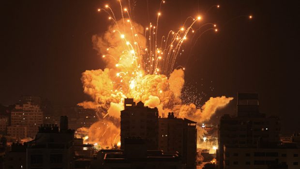 A missile explodes in Gaza City during an Israeli air strike on October 8, 2023. srael, reeling from the deadliest attack on its territory in half a century, formally declared war on Hamas Sunday as the conflict's death toll surged close to 1,000 after the Palestinian militant group launched a massive surprise assault from Gaza. (Photo by MAHMUD HAMS / AFP) (Photo by MAHMUD HAMS/AFP via Getty Images)