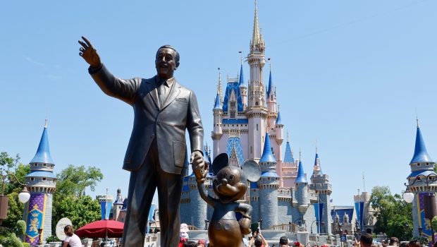 Walt Disney and Mickey Mouse stands in a garden in front of Cinderella's Castle at the Magic Kingdom Park at Walt Disney World on May 31, 2024, in Orlando, Florida. (Photo by Gary Hershorn/Getty Images)