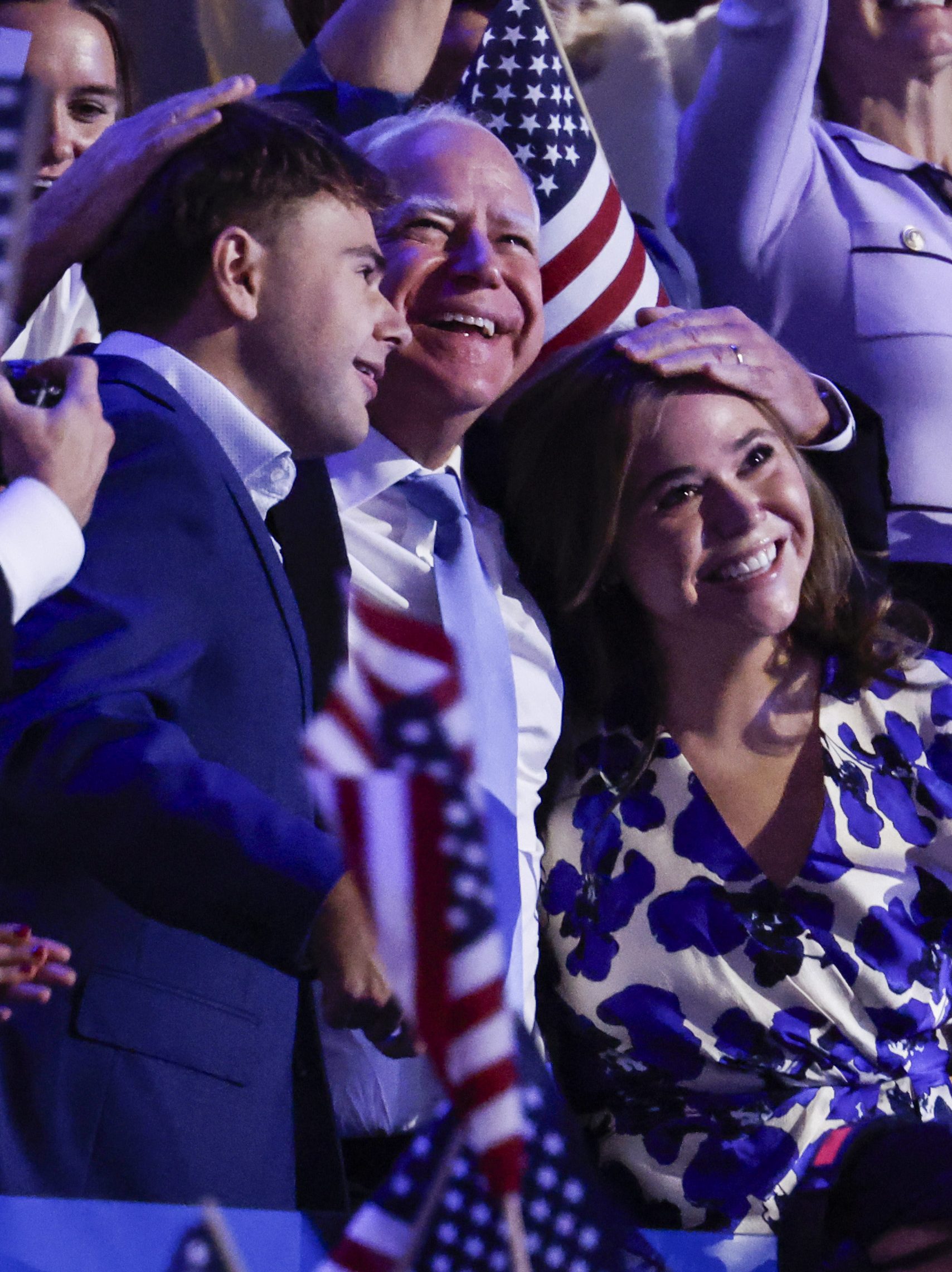 CHICAGO, ILLINOIS - AUGUST 22: Democratic vice presidential nominee Minnesota Gov. Tim Walz (C) hugs his children Gus Walz (L) and Hope Walz (R) during the final day of the Democratic National Convention at the United Center on August 22, 2024 in Chicago, Illinois. Delegates, politicians, and Democratic Party supporters are gathering in Chicago, as current Vice President Kamala Harris is named her party's presidential nominee. The DNC takes place from August 19-22. (Photo by Chip Somodevilla/Getty Images)
