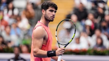 BEIJING, CHINA - SEPTEMBER 27: Carlos Alcaraz of Spain reacts in the Men's Singles First Round against Giovanni Mpetshi Perricard  of France during day five of the 2024 China Open at National Tennis Center on September 27, 2024 in Beijing, China. (Photo by Shi Tang/Getty Images)