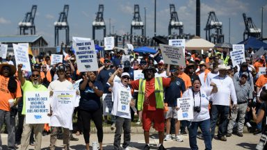 Dockworkers gather at the Bayport Container Terminal in Seabrook, Texas, on October 1, 2024. Officials at 14 ports along the US East and Gulf Coasts were making last-minute preparations on September 30 for a likely labor strike that could drag on the US economy just ahead of a presidential election -- despite last-minute talks. (Photo by Mark Felix / AFP) (Photo by MARK FELIX/AFP via Getty Images)