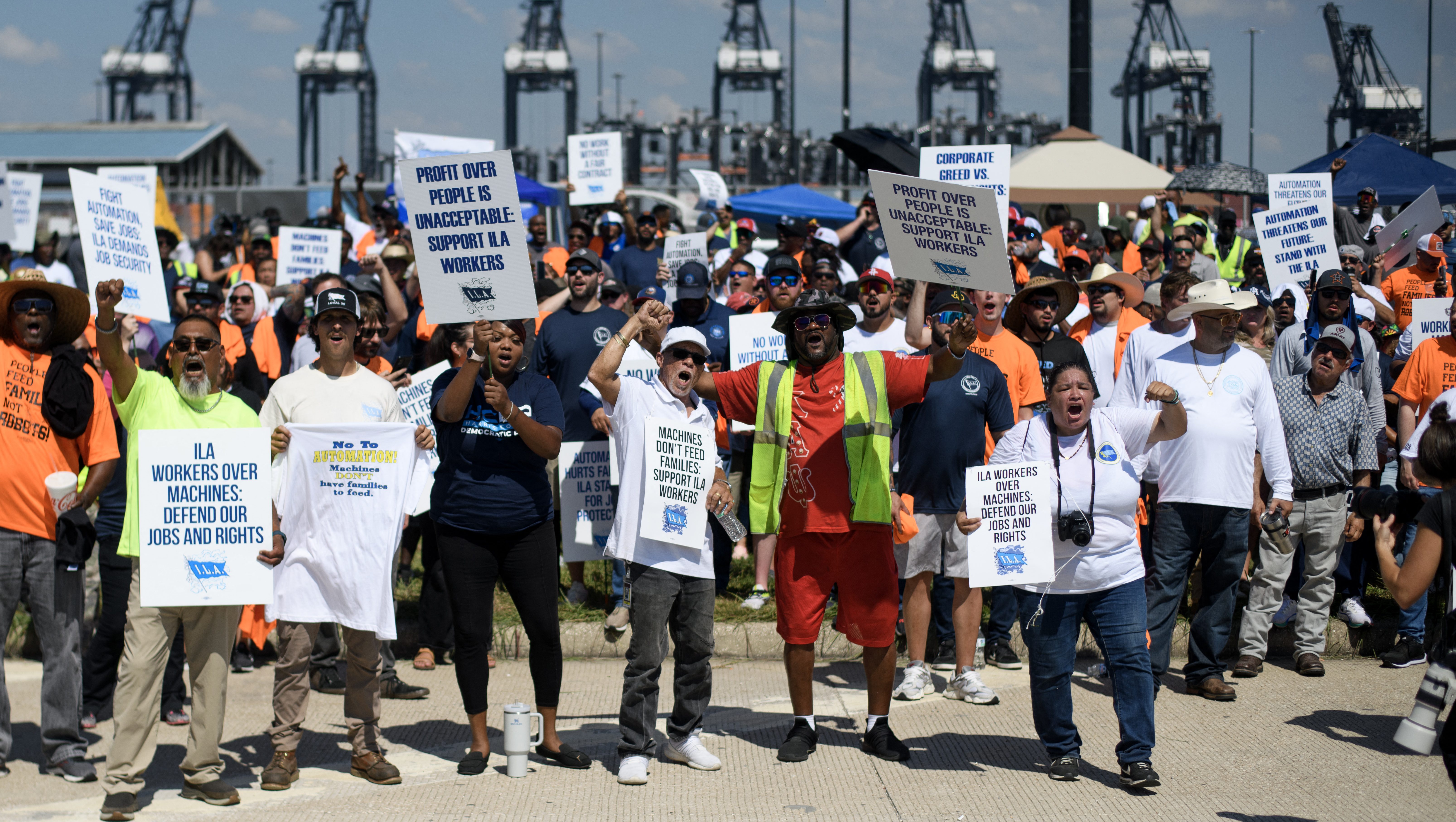 TOPSHOT - Dockworkers gather at the Bayport Container Terminal in Seabrook, Texas, on October 1, 2024. Officials at 14 ports along the US East and Gulf Coasts were making last-minute preparations on September 30 for a likely labor strike that could drag on the US economy just ahead of a presidential election -- despite last-minute talks. (Photo by Mark Felix / AFP) (Photo by MARK FELIX/AFP via Getty Images)