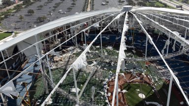 A drone image shows the dome of Tropicana Field which has been torn open due to Hurricane Milton in St. Petersburg, Florida, on October 10, 2024. At least four people were confirmed killed as a result of two tornadoes triggered by Hurricane Milton on the east coast of the US state of Florida, local authorities said Thursday. (Photo by Bryan R. SMITH / AFP) (Photo by BRYAN R. SMITH/AFP via Getty Images)