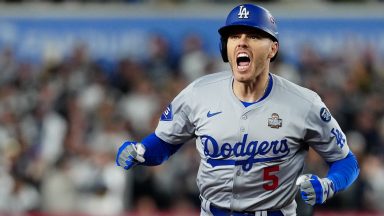    Freddie Freeman #5 of the Los Angeles Dodgers reacts while rounding the bases after hitting a two-run home run in the first inning during Game 3 of the 2024 World Series presented by Capital One between the Los Angeles Dodgers and the New York Yankees at Yankee Stadium on Monday, October 28, 2024 in New York, New York. (Photo by Daniel Shirey/MLB Photos via Getty Images)