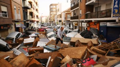  A man speaks on the phone beside a flooded street after flash floods hit the region on October 30, 2024 in the Sedaví area of Valencia, Spain. Spanish authorities said on Wednesday that at least 62 people had died in the Valencia region overnight after flash-flooding followed heavy rain. Spain's meteorological agency had issued its highest alert for the region due to extreme rainfall. (Photo by David Ramos/Getty Images)