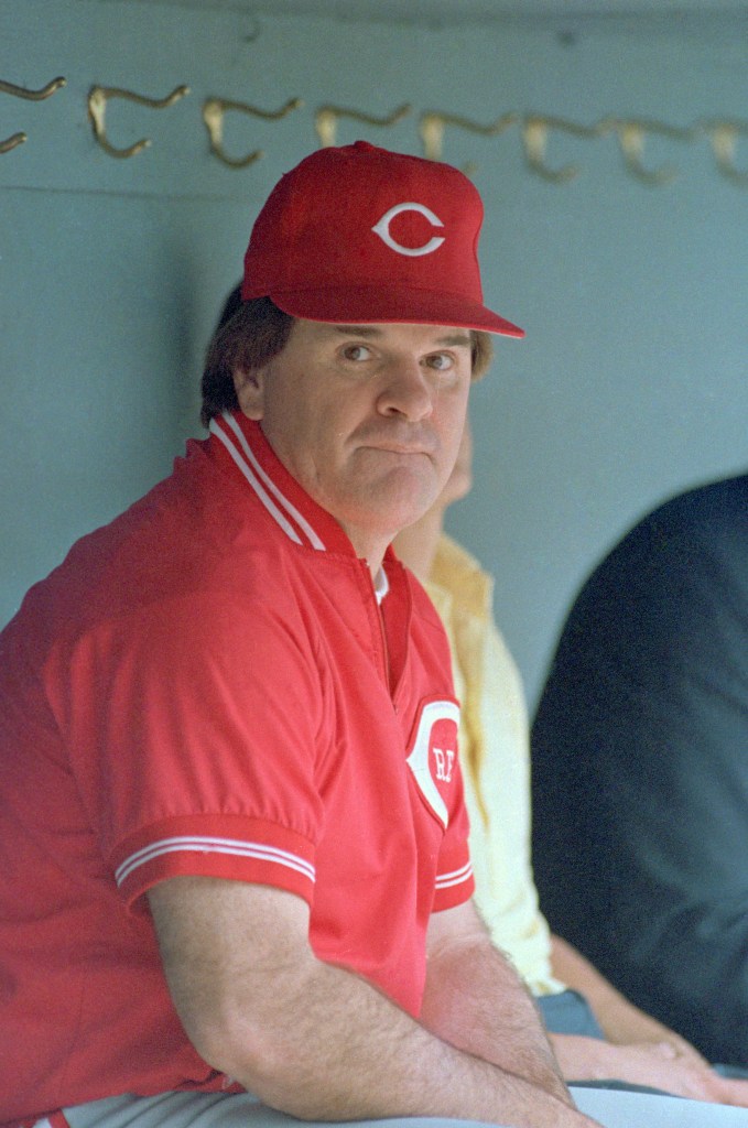  Pete Rose bites his lips in the dugout while watching his team go through workouts just prior to their evening matchup with the Braves. Meanwhile, a lawyer for the baseball commissioner says investigators have uncovered substantial evidence Rose had bet on baseball games.