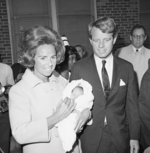 (Original Caption) As Senator Robert Kennedy and his wife Ethel, left New York's Roosevelt Hospital their newborn Matthew Maxwell Taylor Kennedy, The Senator Quipped about his ninth child's future. He's going to be leader of the assembly in Albany... We finally came up with a candidate." Mrs. Kennedy was asked if she planned to have more children. "They're cheaper by the dozen," she said. After leaving the hospital the couple boarded the family plane for Washington, D.C.