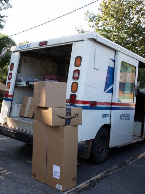 WINTERVILLE, GA - SEPTEMBER 22: Postman Robert Nagel loads packages onto a mail truck outside the post office in Winterville, Georgia.(Dustin Chambers for The Washington Post via Getty Images)