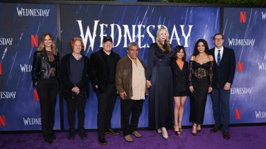 Jennifer Malone, Danny Elfman, Alfred Gough, Luis Guzmán, Gwendoline Christie, Jenna Ortega, Catherine Zeta-Jones, and Miles Millar at the photo call for "Wednesday" held at Hollywood Forever Cemetery on April 29, 2023 in Los Angeles, California. (Photo by Mark Von Holden/Variety via Getty Images)