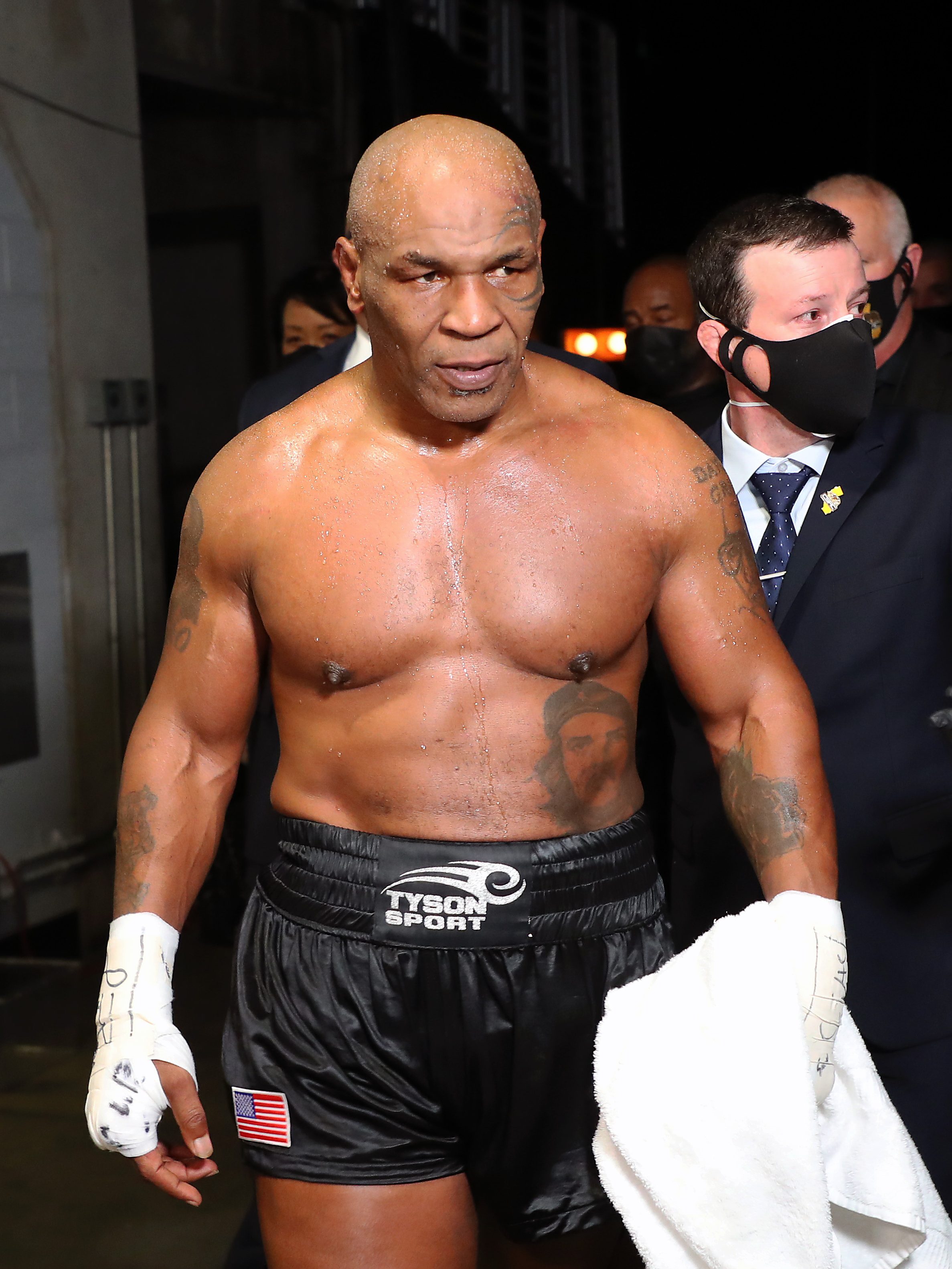 LOS ANGELES, CALIFORNIA - NOVEMBER 28: Mike Tyson exits the ring after receiving a split draw against Roy Jones Jr. during Mike Tyson vs Roy Jones Jr. presented by Triller at Staples Center on November 28, 2020 in Los Angeles, California. (Photo by Joe Scarnici/Getty Images for Triller)