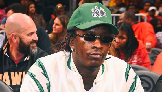 ATLANTA, GEORGIA - MARCH 25:  (EDITORS NOTE: Image has been processed using digital filters.) Rapper Young Thug attends the game between Golden State Warriors and the Atlanta Hawks at State Farm Arena on March 25, 2022 in Atlanta, Georgia. (Photo by Paras Griffin/Getty Images)