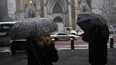  Snow is seen covering the umbrellas of people taking pictures at Rockefeller Center amid a winter storm on February 13, 2024 in New York City. The biggest winter storm in two years is hitting the Northeast with NYC forecasted to get three to five inches of snow. In anticipation of the storm, Mayor Eric Adams announced that schools would be going fully remote today. (Photo by Michael M. Santiago/Getty Images)