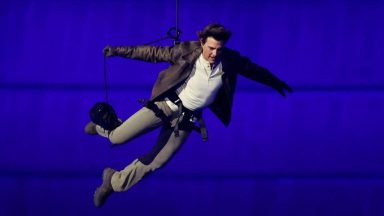  Actor Tom Cruise jumps from the roof of the Stade de France during the Closing Ceremony of the Olympic Games Paris 2024  at Stade de France on August 11, 2024 in Paris, France. (Photo by Fabrizio Bensch- Pool/Getty Images)