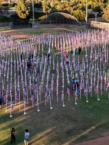ORANGE, CA - November 09: People visit the Field of Valor during the opening ceremony in Orange, CA on Saturday, November 9, 2024. The display features a field of flags honoring veterans and active military service members. (Photo by Paul Bersebach/MediaNews Group/Orange County Register via Getty Images)