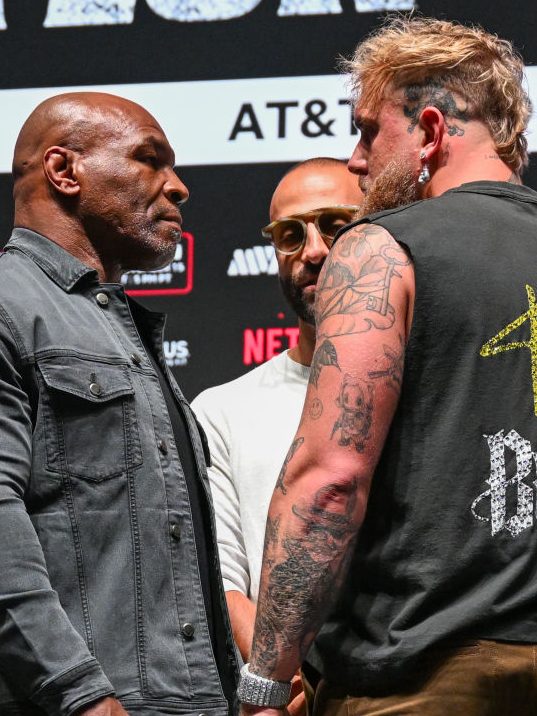 IRVING, TEXAS - NOVEMBER 13: Mike Tyson and Jake Paul pose at a press conference at the Toyota Music Factory in Irving, Texas on November 13, 2024 for their heavyweight world titles of the Premiere Boxing Championship which will be on November 15 Friday night at AT&T Stadium in Arlington, Texas, United States. (Photo by Tayfun Coskun/Anadolu via Getty Images)