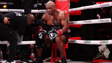 ARLINGTON, TEXAS - NOVEMBER 15: Mike Tyson fights during LIVE On Netflix: Jake Paul vs. Mike Tyson at AT&T Stadium on November 15, 2024 in Arlington, Texas. (Photo by Al Bello/Getty Images for Netflix © 2024)