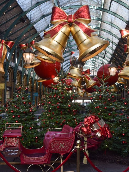 LONDON, UNITED KINGDOM - 2024/11/25: Christmas decorations, trees and Santa's sleigh at Covent Garden Market. (Photo by Vuk Valcic/SOPA Images/LightRocket via Getty Images)