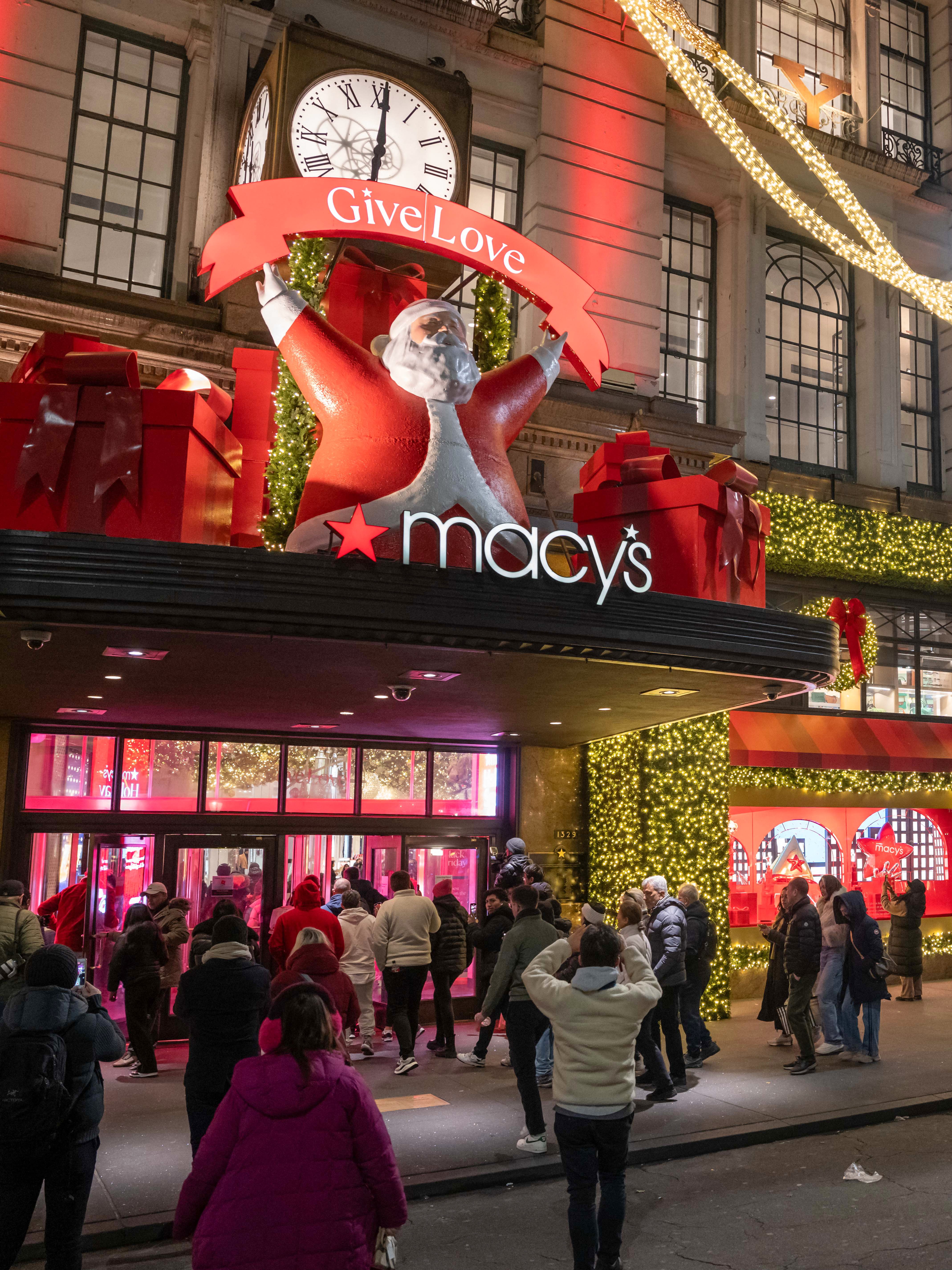 People line up outside of Macy's flagship store before opening on Black Friday, in New York City on November 29, 2024. The annual Black Friday shopping day has always been about finding the best deals, but this year retailers are preparing for a US consumer more zealously fixated than ever on getting value for their money. (Photo by Adam GRAY / AFP) (Photo by ADAM GRAY/AFP via Getty Images)
