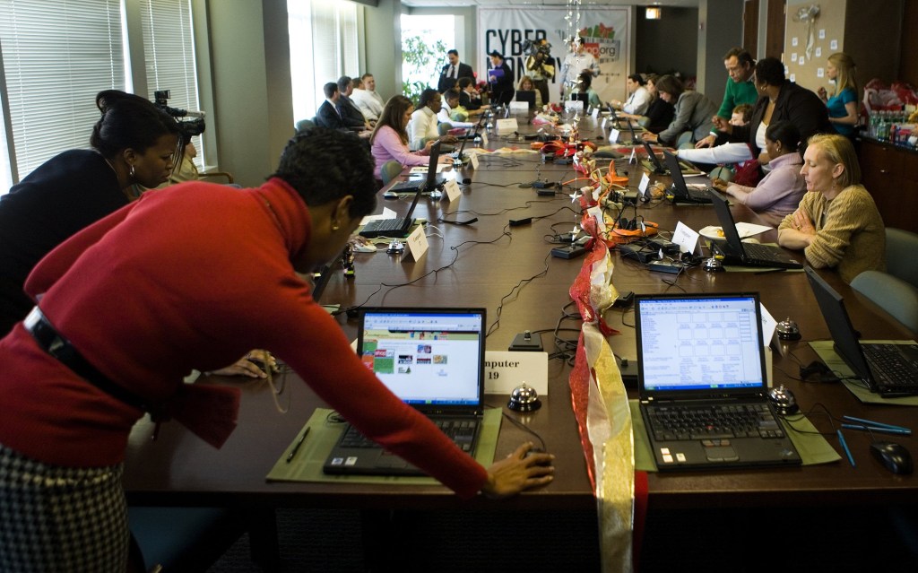 WASHINGTON - NOVEMBER 27:  Consumers shop online during a shop and lunch event in the boardroom of the National Retail Federation November 27, 2006 in Washington, DC. The National Retail Federation, a retail trade group, provided laptop computers, personal shoppers and lunch to encourage shoppers who stopped by to participate in Cyber Monday, the online retail world's equivalent of Black Friday.  (Photo by Brendan Smialowski/Getty Images)