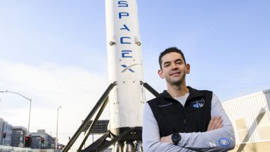 Inspiration4 mission commander Jared Isaacman, founder and chief executive officer of Shift4 Payments, stands for a portrait in front of the recovered first stage of a Falcon 9 rocket at Space Exploration Technologies Corp. (SpaceX) on February 2, 2021 in Hawthorne, California. - Isaacman's all-civilian Inspiration4 mission will raise $200 million for St. Jude Children's Research Hospital through a donation based sweepstakes to select a member of the crew. (Photo by Patrick T. FALLON / AFP) (Photo by PATRICK T. FALLON/AFP via Getty Images)