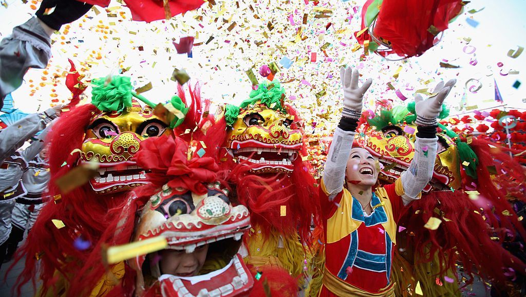 BEIJING, CHINA - JANUARY 22:   Chinese folk artists perform the lion dance at a temple fair to celebrate the Lunar New Year of Dragon on January 22, 2012 in Beijing, China. Falling on January 23 this year, the Chinese Lunar New Year, also known as the Spring Festival, which is based on the Lunisolar Chinese calendar, is celebrated from the first day of the first month of the lunar year and ends with Lantern Festival on the Fifteenth day.  (Photo by Feng Li/Getty Images)