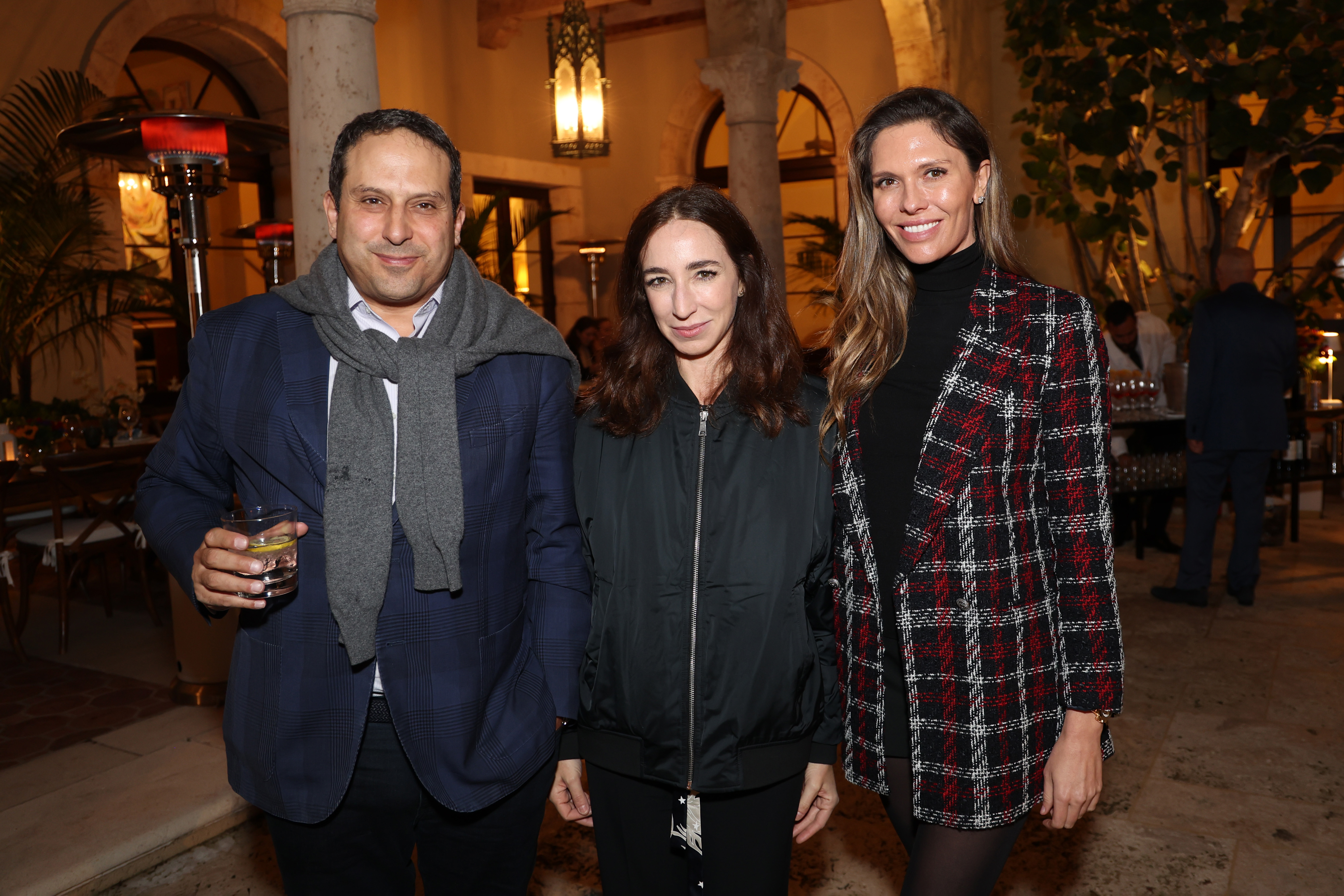 WEST PALM BEACH, FLORIDA - DECEMBER 27: Farhad Farman, Silvia Di Paolo, and Bettina Anderson attend a private dinner following the screening of 