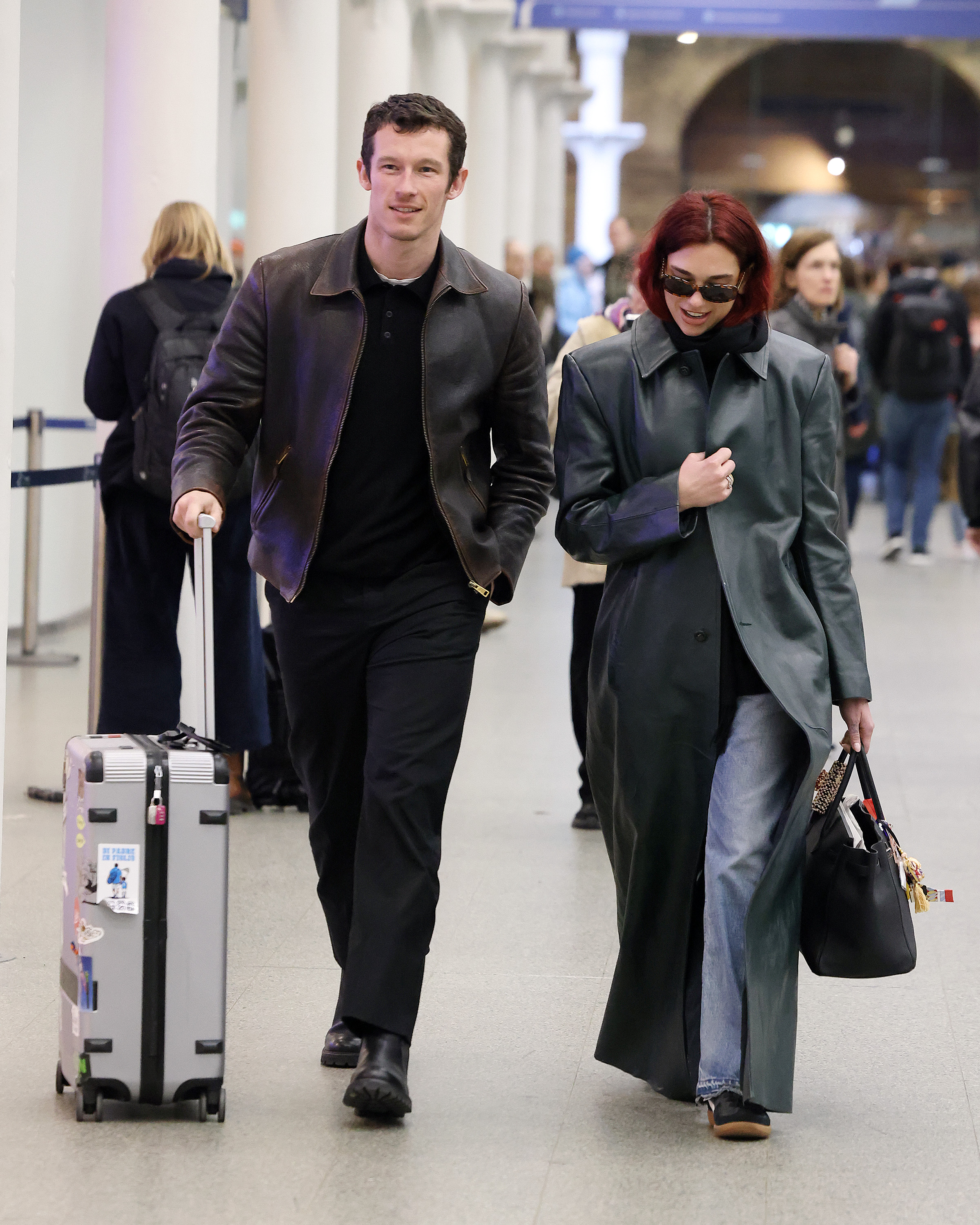 Dua Lipa & Callum Turner: Pics of the Couple   London St Pancras Station after taking the Eurostar from Paris on March 26, 2024 in London, England