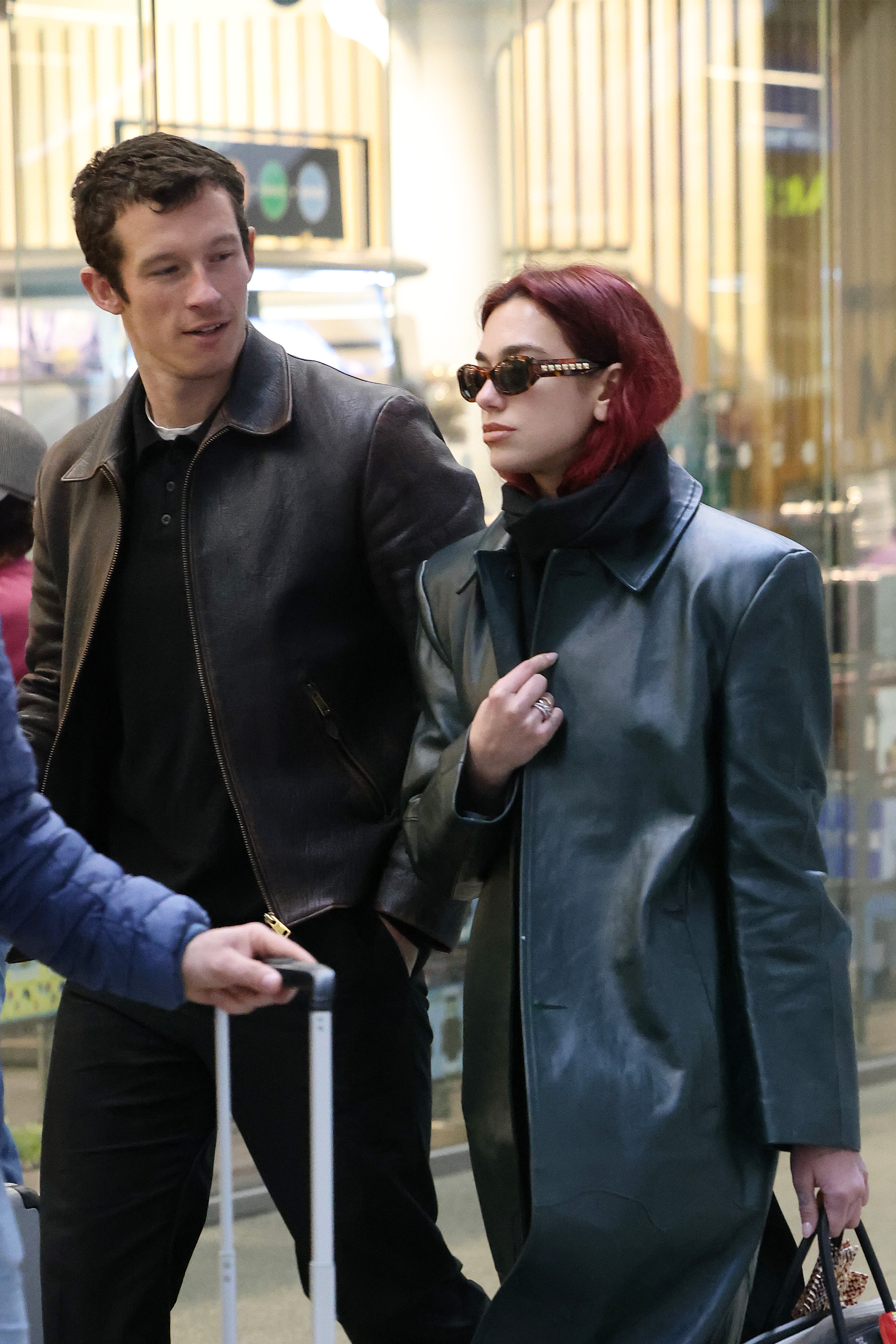 Dua Lipa & Callum Turner: Pics of the Couple   London St Pancras Station after taking the Eurostar from Paris on March 26, 2024 in London, England