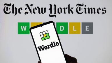 The Wordle logo is being displayed on a smartphone with The New York Times visible in the background in this photo illustration in Brussels, Belgium, on June 1, 2024. (Photo by Jonathan Raa/NurPhoto)