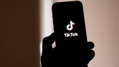 MELBOURNE, AUSTRALIA - NOVEMBER 30: In this photo illustration, the TikTok logo is displayed on a phone screen on November 30, 2024 in Melbourne, Australia. Australia has recently enacted a groundbreaking law prohibiting individuals under the age of 16 from accessing social media platforms, marking one of the strictest regulations of its kind globally. This legislation, which holds social media companies accountable for enforcing the ban with potential fines of up to AUD 50 million, aims to protect young users from online dangers such as bullying and exploitation, reflecting a significant shift in how governments address youth safety in the digital age. (Photo Illustration by Asanka Ratnayake/Getty Images)