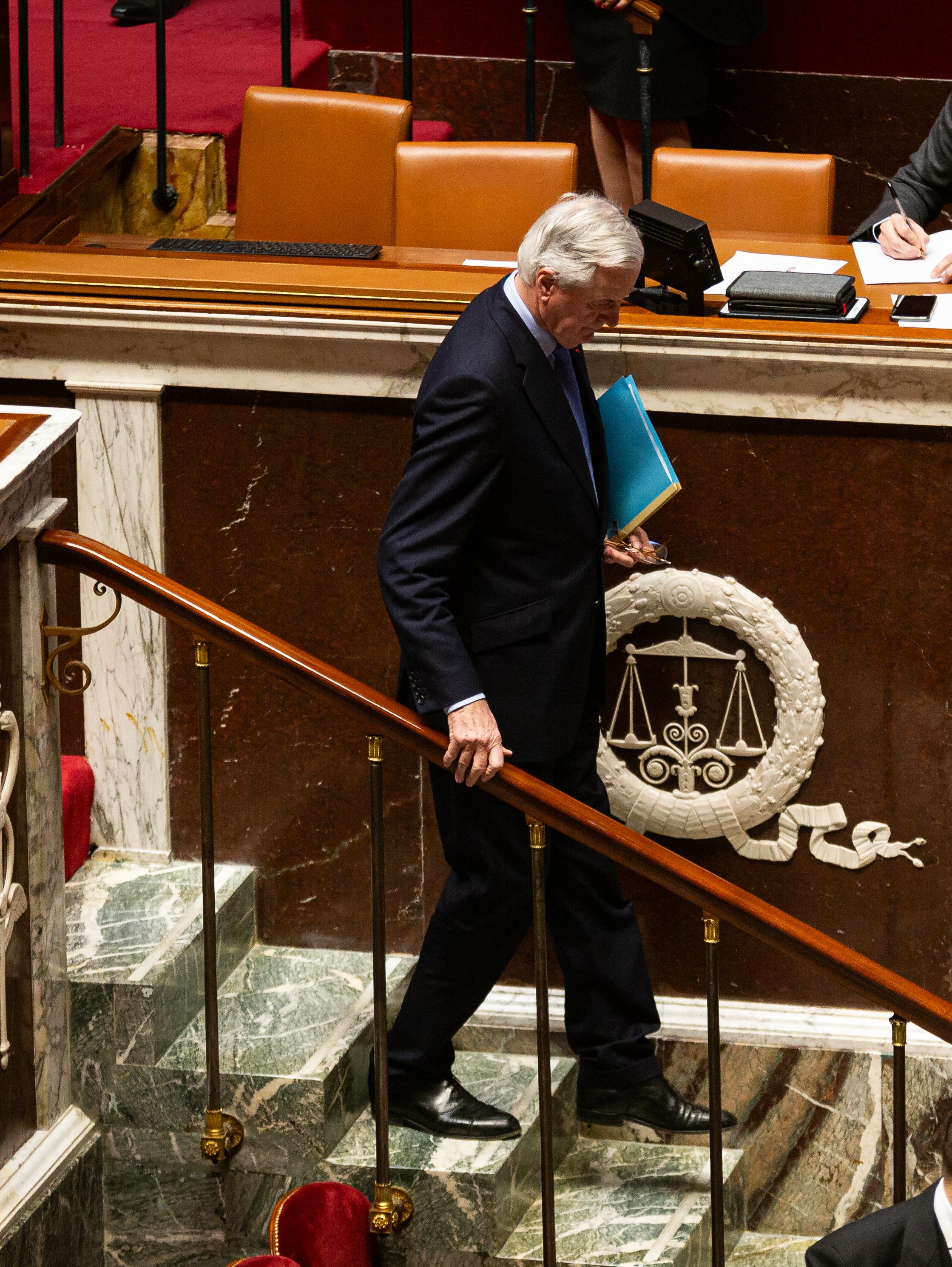 PARIS, FRANCE - 2024/12/04: French Prime Minister Michel Barnier seen after his speech on the discussion of the motion of censure at the National Assembly. The French National Assembly has adopted a motion of censure against Prime Minister Michel Barnier, deposing him after just three months in office. The motion was supported by the left-wing Nouveau Front Populaire coalition and the far-right Rassemblement National party, securing 331 votes in favor. This marks a significant political shift as the assembly ousts the head of government. (Photo by Telmo Pinto/SOPA Images/LightRocket via Getty Images)