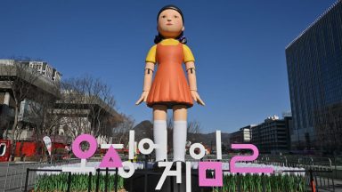 An inflatable Young-hee doll is displayed to promote Netflix's South Korean series "Squid Game Season 2" at Gwanghwamun Square in Seoul on December 26, 2026. (Photo by Jung Yeon-je / AFP) (Photo by JUNG YEON-JE/AFP via Getty Images)