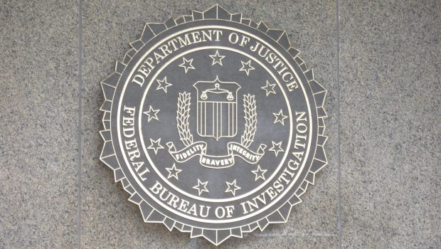 Washington, USA - August 11, 2009: FBI emblem on the J. Edgar Hoover F.B.I. Building in downtown Washington, DC.