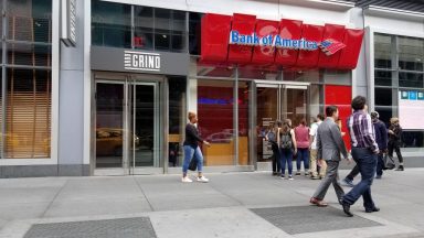 People walk past the Bank of America branch near Penn Station in Times Square, New York City, New York, September 15, 2017. (Photo by Smith Collection/Gado/Getty Images)