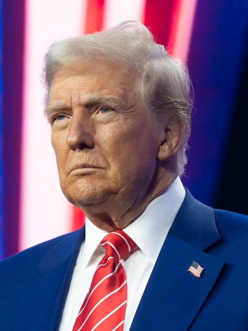 PHOENIX, ARIZONA - DECEMBER 22: U.S. President-elect Donald Trump looks on during Turning Point USA's AmericaFest at the Phoenix Convention Center on December 22, 2024 in Phoenix, Arizona. The annual four day conference geared toward energizing and connecting conservative youth hosts some of the country's leading conservative politicians and activists. (Photo by Rebecca Noble/Getty Images)