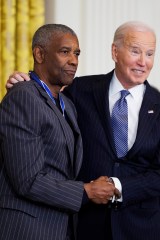 WASHINGTON, DC - JANUARY 4: Actor Denzel Washington greets U.S. President Joe Biden after being awarded the Presidential Medal of Freedom in the East Room of the White House on January 4, 2025 in Washington, DC. President Biden is awarding 19 recipients with the nation's highest civilian honor. President Biden is awarding 19 recipients with the nation's highest civilian honor. (Photo by Tom Brenner/Getty Images)