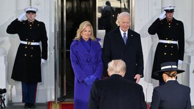 US President Joe Biden, First Lady Jill Biden (L) greet President-elect Donald Trump (2nd R) and wife Melania Trump (R) as they arrive at the White House in Washington, DC, on January 20, 2025, before departing for the US Capitol where Trump will be sworn in as the 47th US President. (Photo by ROBERTO SCHMIDT / AFP) (Photo by ROBERTO SCHMIDT/AFP via Getty Images)