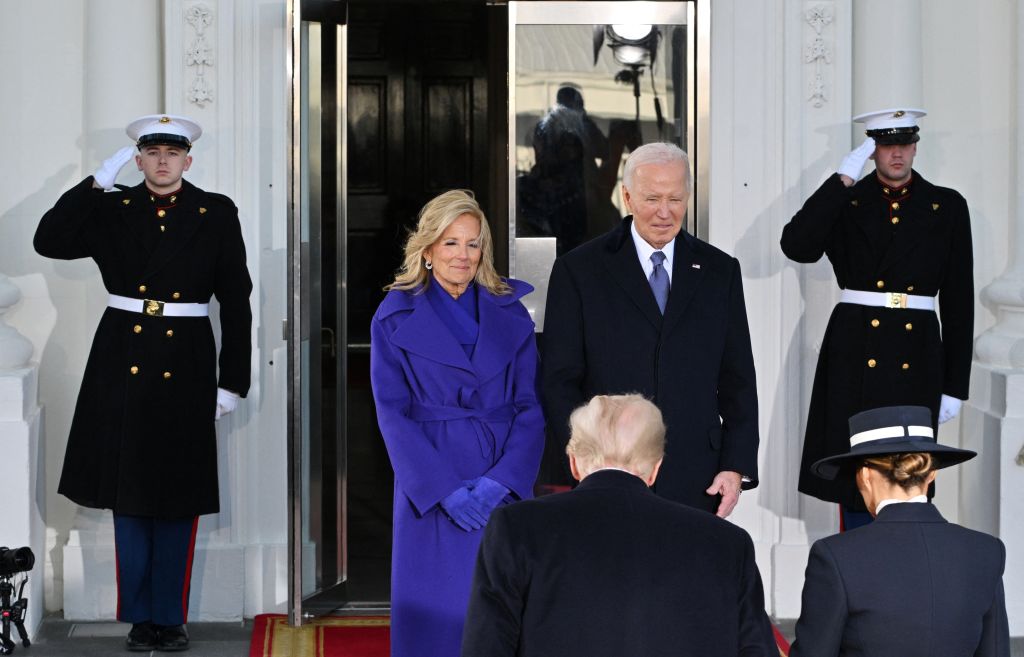 US President Joe Biden, First Lady Jill Biden (L) greet President-elect Donald Trump (2nd R) and wife Melania Trump (R) as they arrive at the White House in Washington, DC, on January 20, 2025, before departing for the US Capitol where Trump will be sworn in as the 47th US President. (Photo by ROBERTO SCHMIDT / AFP) (Photo by ROBERTO SCHMIDT/AFP via Getty Images)