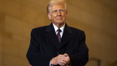 US President Donald Trump waits to speak in Emancipation Hall during inauguration ceremonies at the US Capitol in Washington, DC, on January 20, 2025. (Photo by Greg Nash / POOL / AFP)