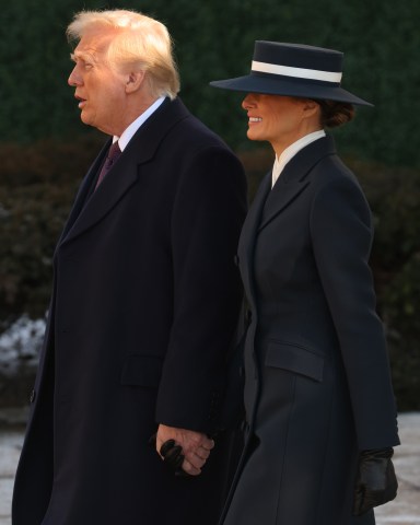 WASHINGTON, DC - JANUARY 20: Melania Trump and U.S. President-elect Donald Trump leave after services at St. John's Church as part of Inauguration ceremonies on January 20, 2025 in Washington, DC. Donald Trump takes office for his second term as the 47th president of the United States. (Photo by Scott Olson/Getty Images)