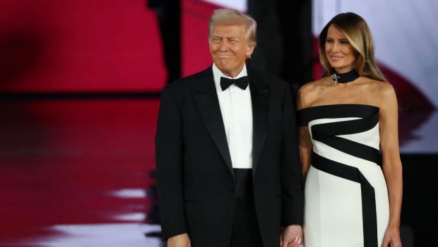 WASHINGTON, DC - JANUARY 20: President Donald Trump on stage with his wife First Lady Melania Trump at the Liberty Inaugural Ball on January 20, 2025 in Washington, DC.  President  DonaldTrump attends some of the inaugural balls after taking the oath as the 47th president. (Photo by Joe Raedle/Getty Images)